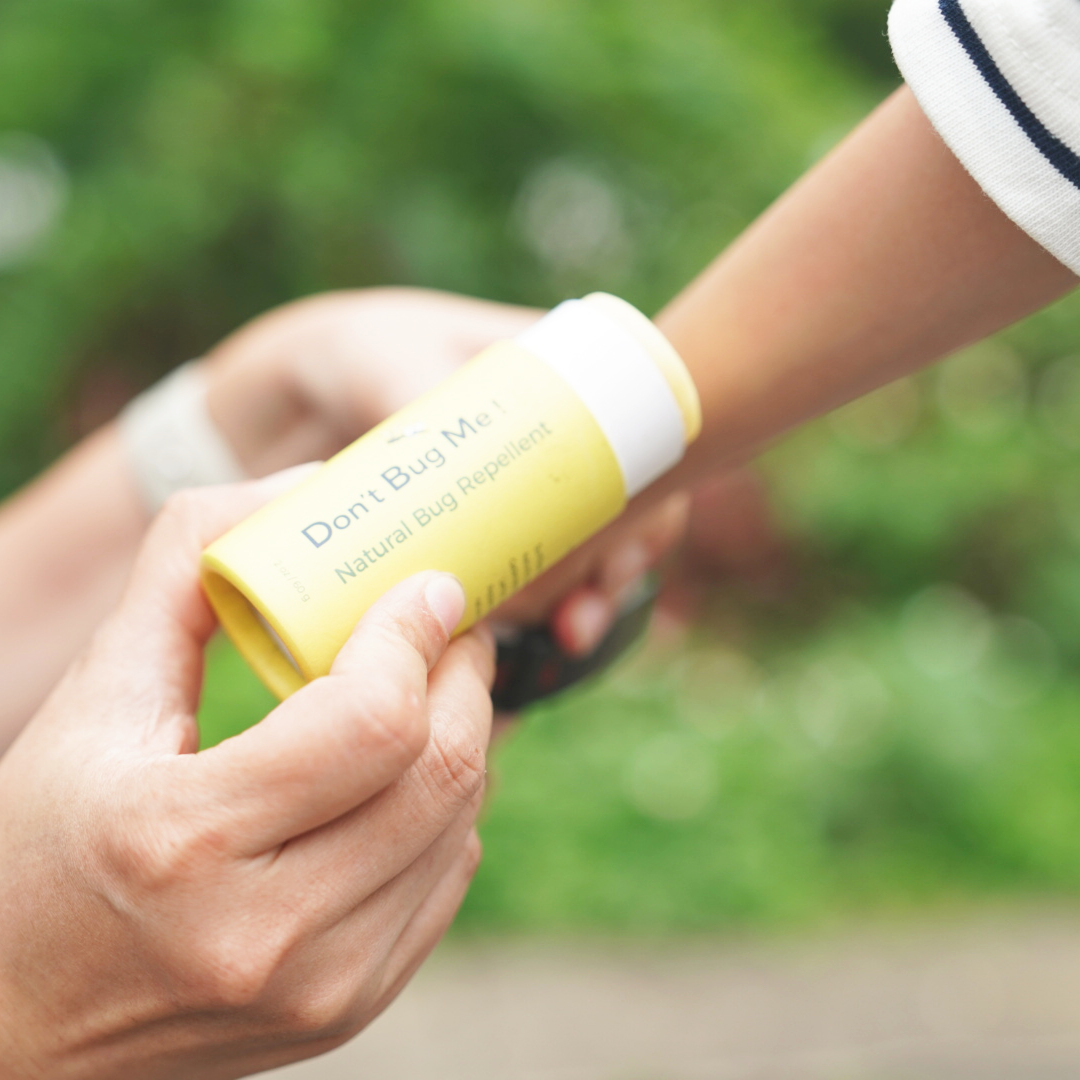 Oliver Flynn Don’t Bug Me DEET-free mosquito repellent balm with citronella, lemongrass, shea butter, and beeswax for children and families.