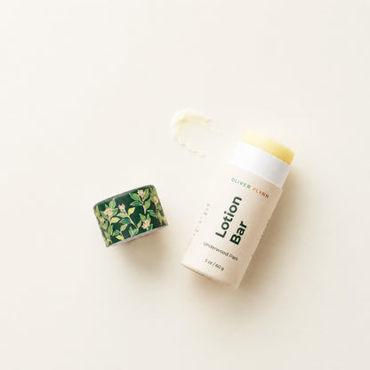Oliver Flynn Underwood Park Lotion Bar with mango butter and jojoba oil provides silky, non-greasy moisture for dry skin. Handcrafted in small batches in Brooklyn and packaged in a plastic-free, compostable paper push-up tube, it is an eco-friendly and travel-friendly solid moisturizer.