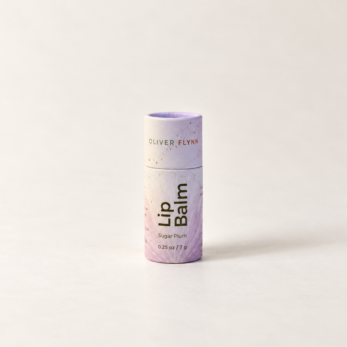 Oliver Flynn Lip Balm in the Sugar Plum tube packaging, standing upright on a clean white surface against a white background.