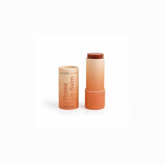 Oliver Flynn Berry Cherry Tinted Lip Balm delivers a sheer, buildable berry-brown tint with a subtle mineral shimmer. Made with nourishing plant oils, beeswax, and mineral-based pigments, it moisturizes dry lips while adding a lightweight, natural wash of color.
